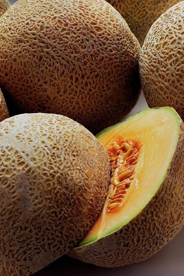 A Cantaloupe Sliced In Half Photograph by Romulo Yanes