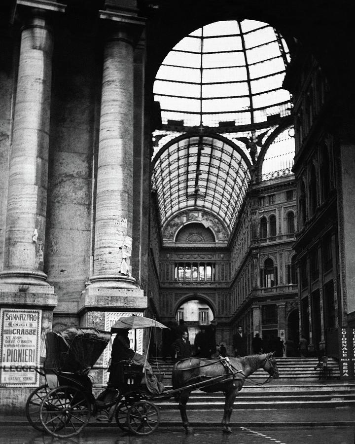 Historic Architecture with Horse Carriage Photograph - A Horse And Cart By The Galleria Umberto by Robert Randall