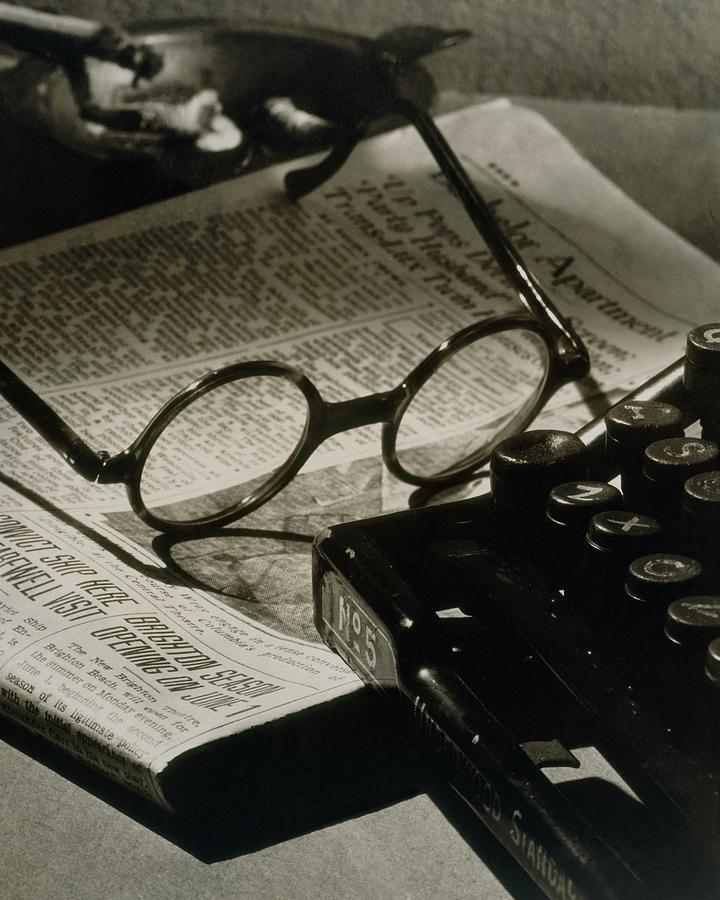 Vintage Office Still Life Photograph - A Pair Of Glasses On Top Of A Newspaper by Irving Browning
