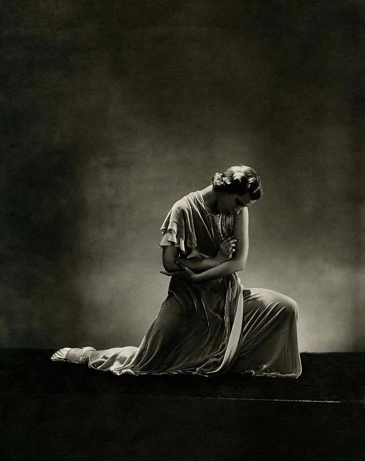 Solitary Pensive Woman on Stage Photograph - Alanova Kneeling In A Dress by George Hoyningen-Huene