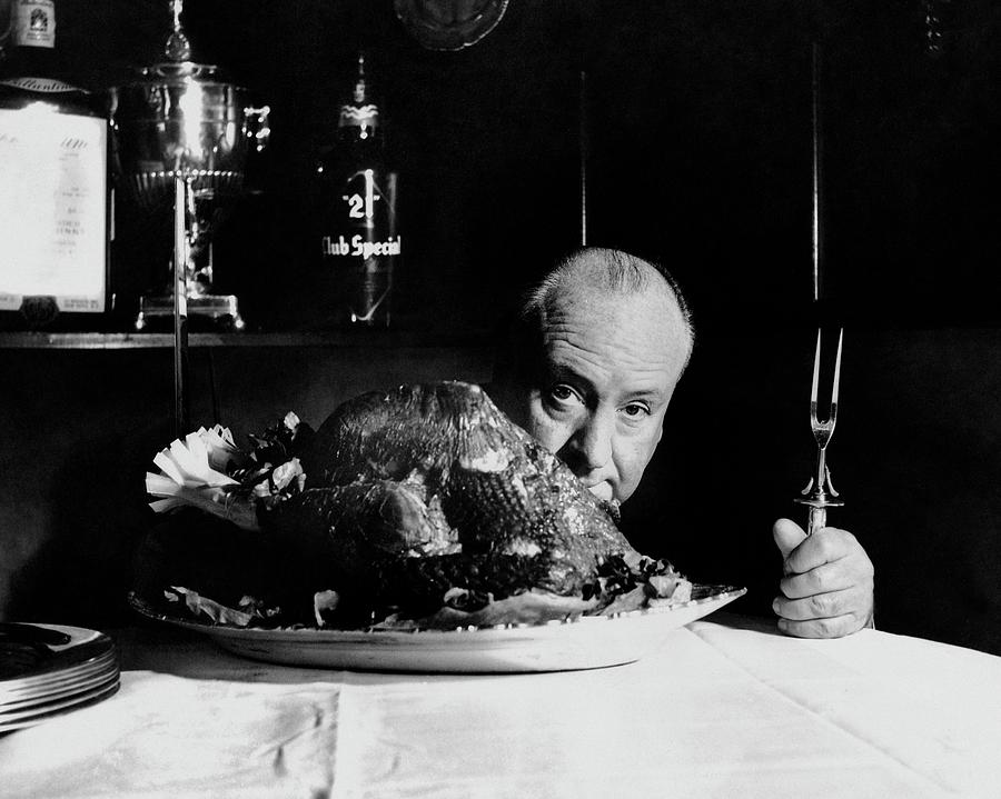 Man with a Fork Behind a Turkey Photograph - Alfred Hitchcock Looking At The Camera by John Rawlings