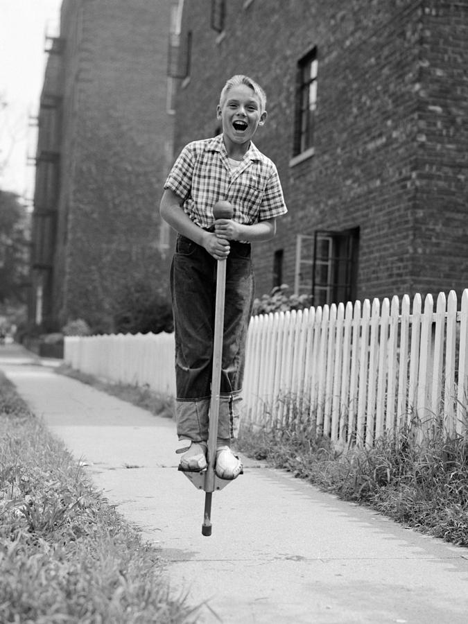 Boy On Pogo Stick, C.1960s by Debrocke/ClassicStock display picture 1
