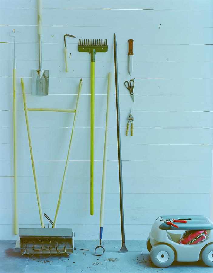 Organized Garden Tools Against Wall Photograph - Gardening Tools by Romulo Yanes