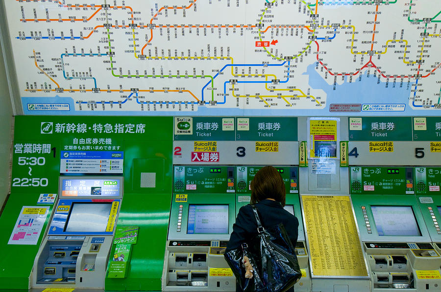 girl at ticket machine Shibuya Tokyo Photograph by Tom Bonaventure