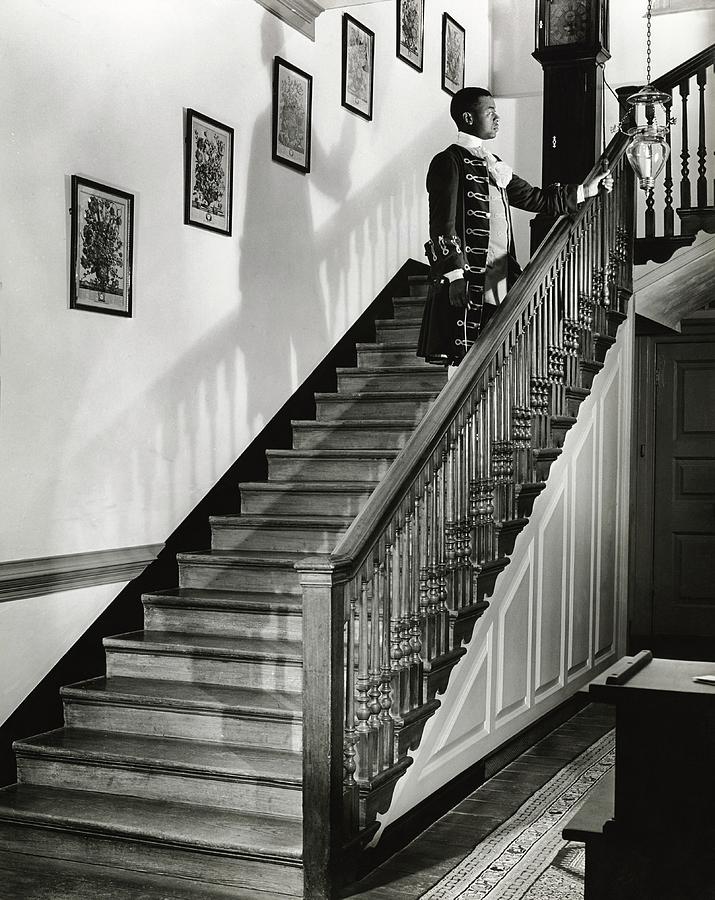 Historic Grand Staircase Photograph - Man Dressed As Colonial Butler On The Stair by George Karger
