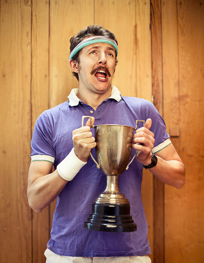 Man with trophy Photograph by Alija