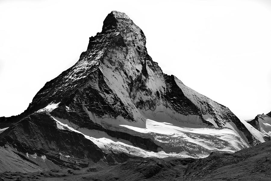 Matterhorn north face, snow capped, triangle shaped, high-contrast black and white. Photograph by Andrew Merry