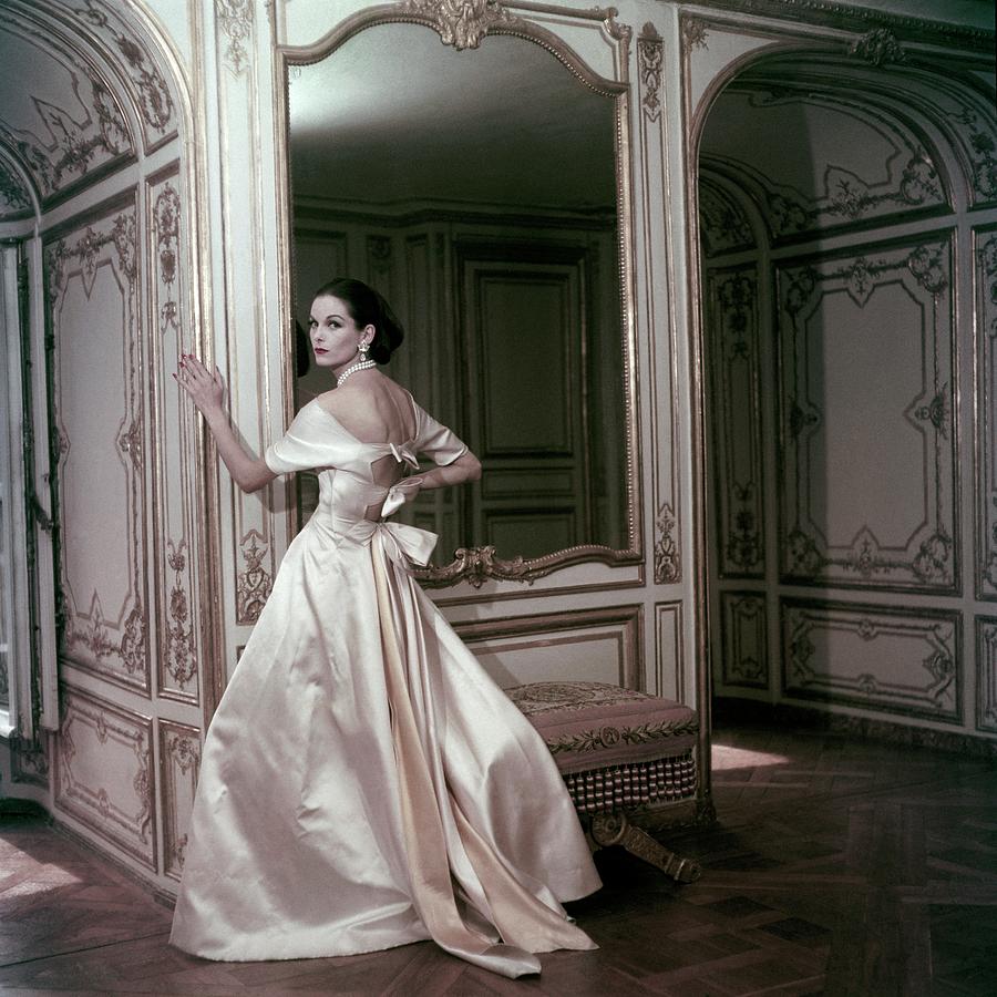Model Wearing A Satin Evening Dress By Griffe by Henry Clarke