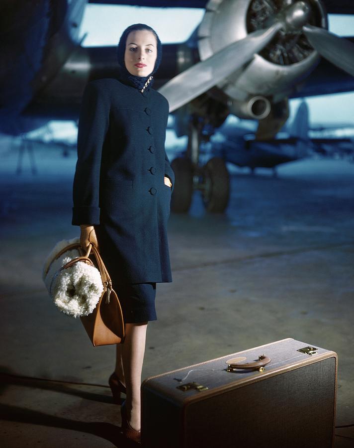 Elegant Traveler at the Airport Photograph - Model Wearing Ceil Chapman Coat At Airport by Frances McLaughlin-Gill