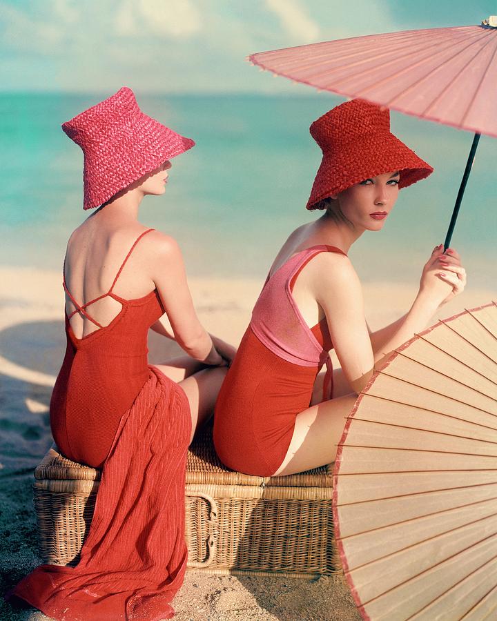 Elegant Beach Fashion with Straw Hats Photograph - Models At A Beach by Louise Dahl-Wolfe