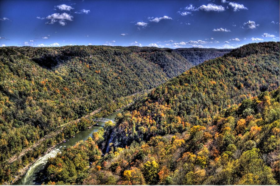 River running through a valley Photograph by Jonny D