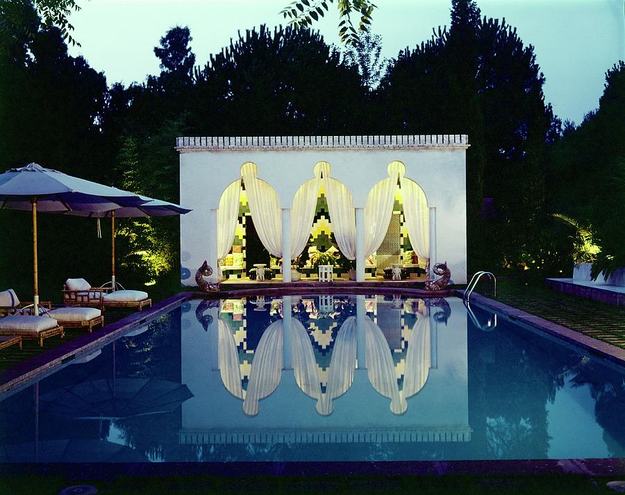 Valentino's Elegant Poolside Evening Photograph - Valentinos Swimming Pool by Horst P. Horst