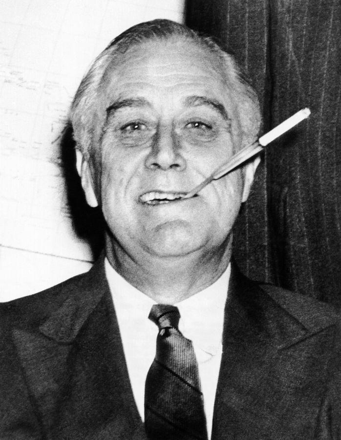 franklin roosevelt cigarette holder President Roosevelt, debonair with his holder. He is at the wheel of his customized auto in 1939 Stock Photo President Franklin D. Roosevelt, smoking