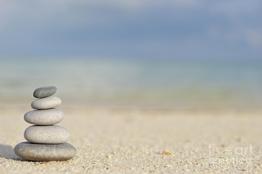 Stack of pebbles on beach #3 Photograph by Sami Sarkis Photography
