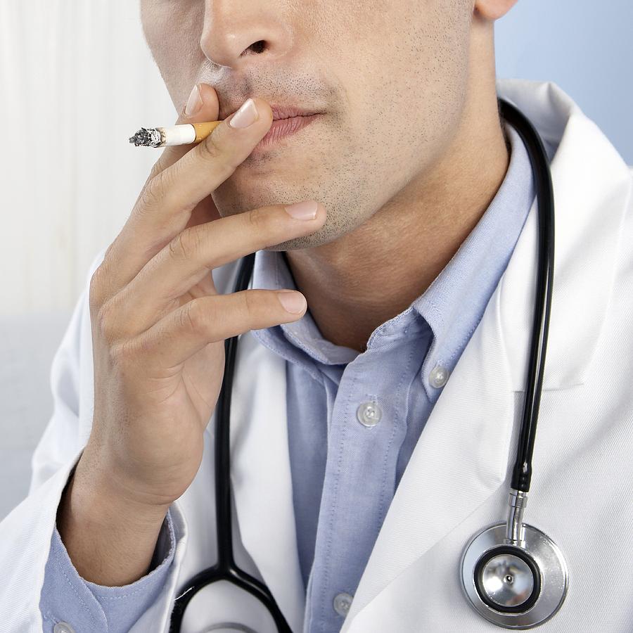 Doctor Smoking by Adam Gault / Science Photo Library