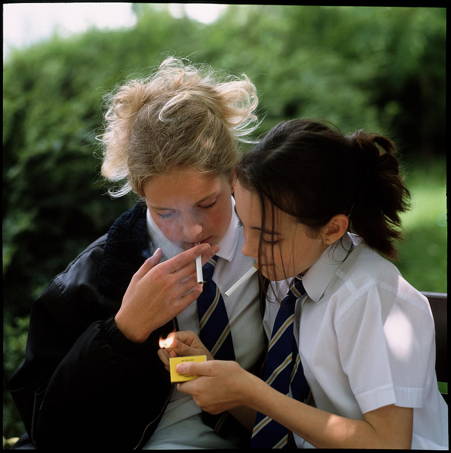 teenagers smoking cigarettes Young Teenage Girls Lighting Cigarettes Outdoors by Damien Lovegrove /  Science Photo Library