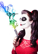 Sugar skull girl blowing on smoking gun Photograph by Jorgo Photography