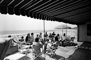 A Group Of People On A Terrace Overlooking Photograph by Tom Leonard