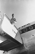 A Male Model Disembarking A Twa Boeing 707 Plane Photograph by Leonard Nones