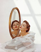 A Model Looking Into A Mirror Photograph by John Rawlings
