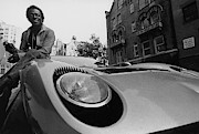 Jazz Musician Miles Davis Sitting On The Hood Photograph by Mark Patiky