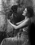 Jeanne Eagels Lifting Up A Small Dog Photograph by Arnold Genthe