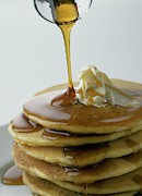 Maple Syrup Being Poured Onto A Stack Of Pancakes Photograph by Romulo Yanes