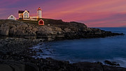 Nubble Lighthouse At Sunset Photograph by Susan Candelario