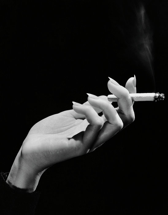 holding cigarette holder Womans Hand Holding Lit Cigarette Greeting Card by George Marks