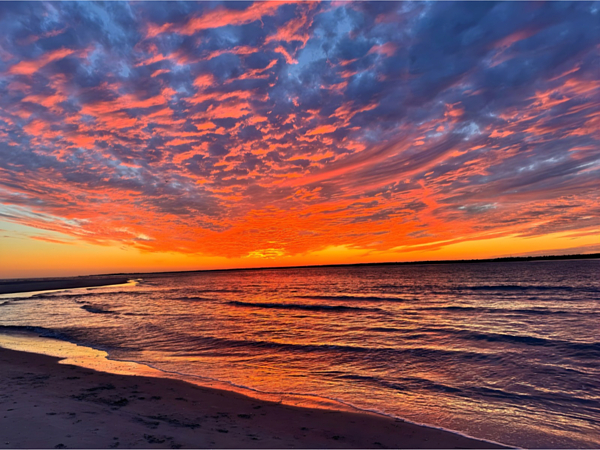 Vibrant Sunset Over Ocean Waves Jigsaw Puzzle by Olivia Leedham