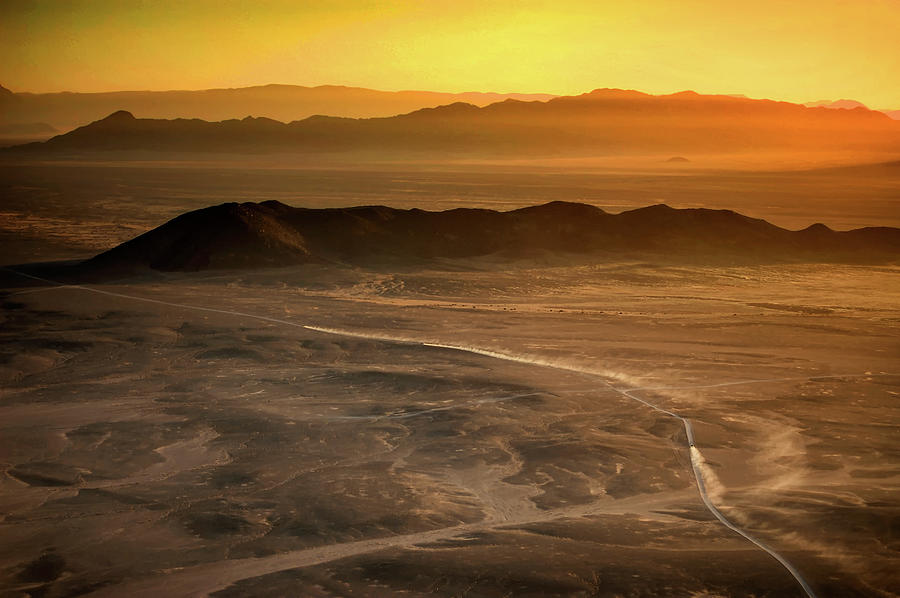 Flying over the desert Photograph by Alberto Audisio