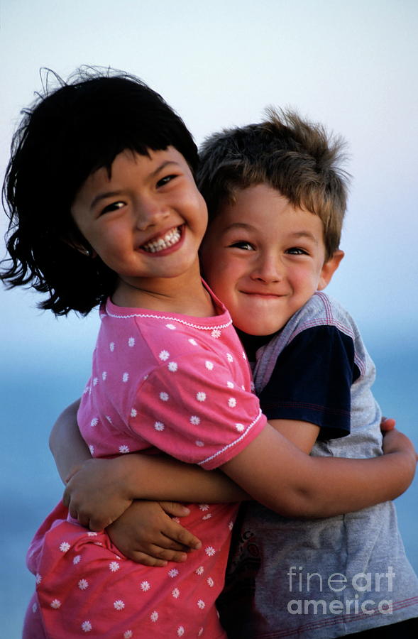 Smiling Kids Hugging Photograph - Girl and boy embracing by Sami Sarkis Photography