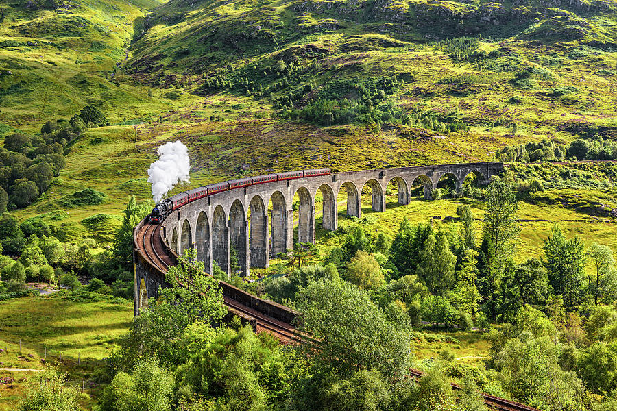 Glenfinnan Railway Viaduct in Scotland with a steam train Photograph by Miroslav Liska