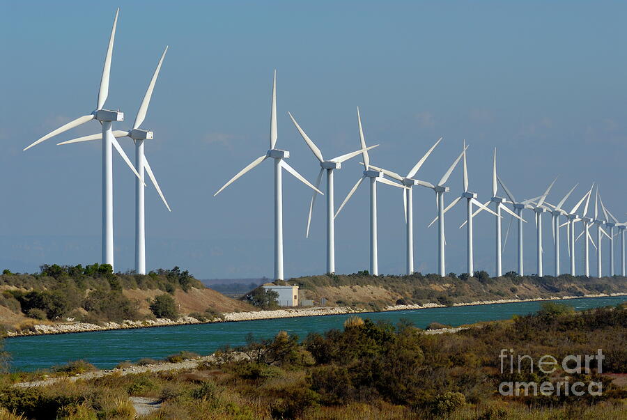 Row of Wind Turbines by the Coast Photograph - Row of wind turbines along canal by Sami Sarkis Photography