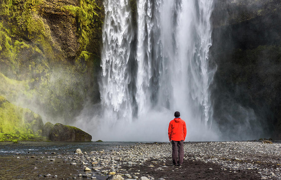 Tourist at the Skogafoss waterfall in southern Iceland Photograph by Miroslav Liska