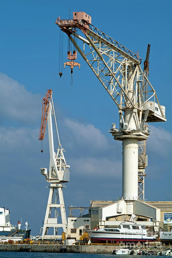 Two large cranes on La Ciotat Port Photograph by Sami Sarkis Photography
