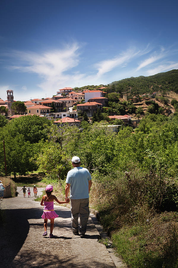Walk with grand-daughter Photograph by Al Poullis
