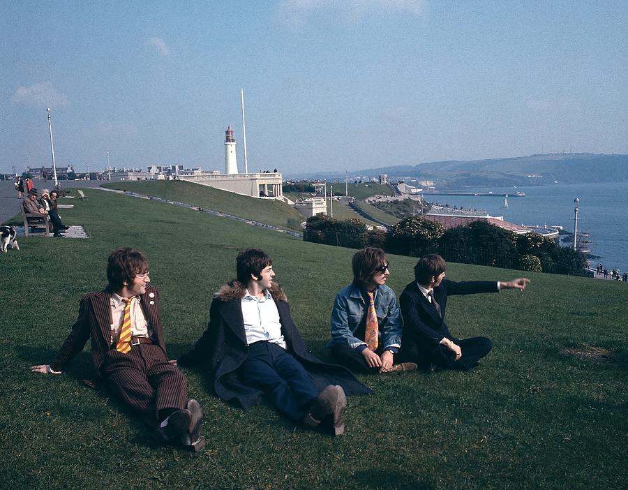 Band Relaxing on Coastal Lawn Photograph - Photo Of Magical Mystery Tour And #1 by David Redfern