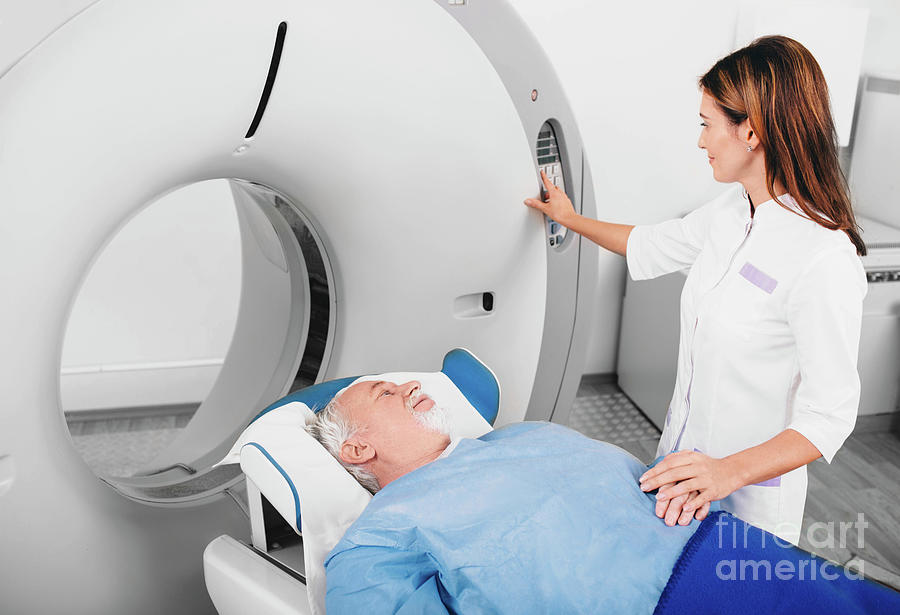 Man Having Ct Scan #8 by Peakstock / Science Photo Library