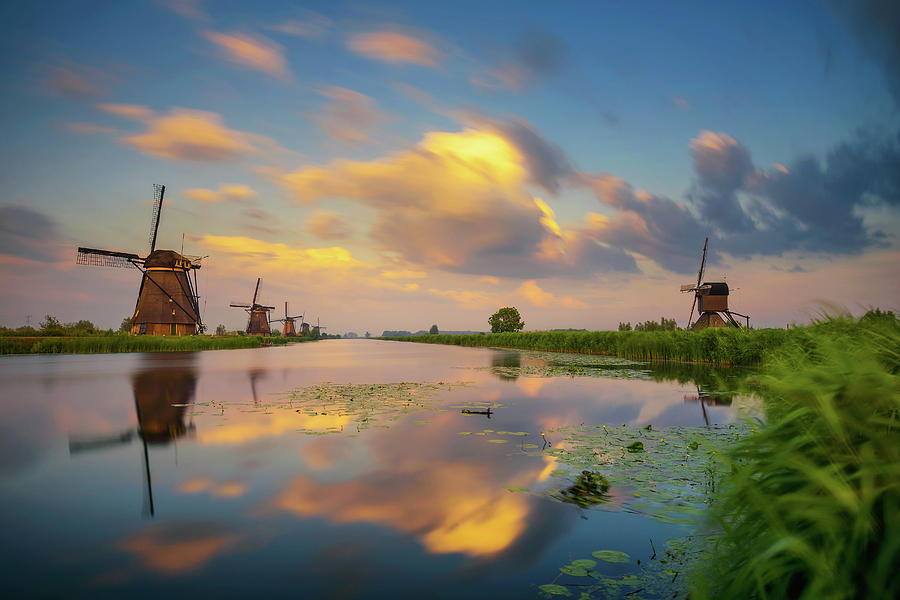 Sunset above old dutch windmills in Kinderdijk, Netherlands #8 Photograph by Miroslav Liska