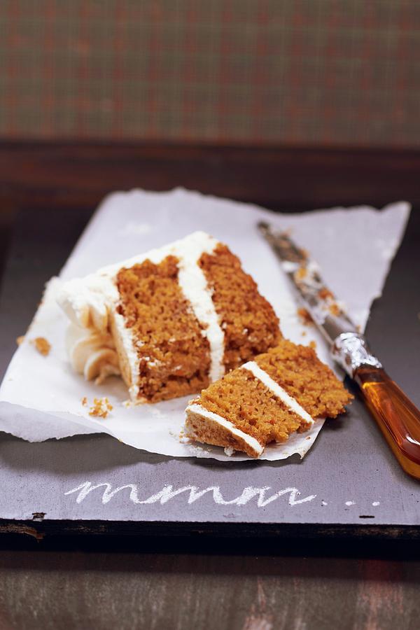 A Slice Of Carrot Cake With Cream Cheese Frosting, Cut In Two Pieces Photograph by Miriam Rapado