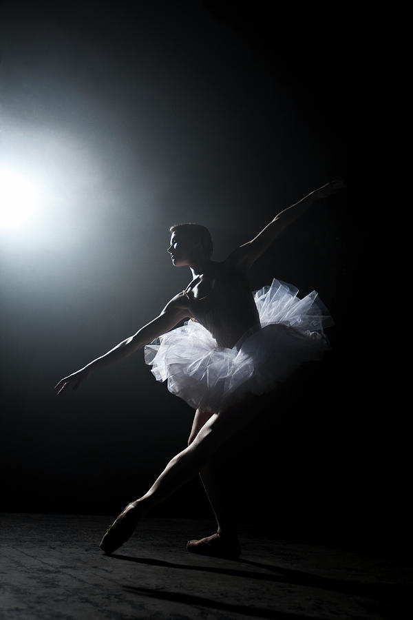 Ballerina Performing On Stage Under by Nisian Hughes