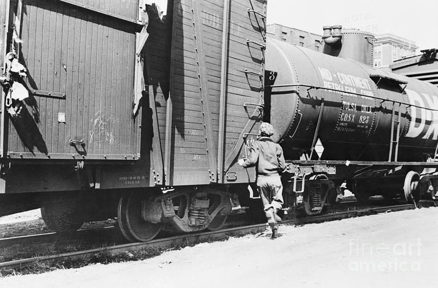 Person Racing A Train Boy Racing To Board Train As Hobo Rider by Bettmann