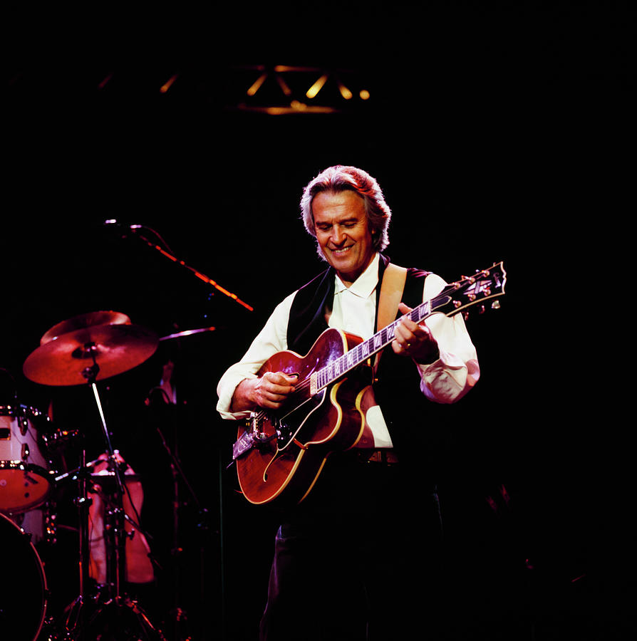 Guitarist Performing on Stage Photograph - John Mclaughlin Performs At Vienne by David Redfern