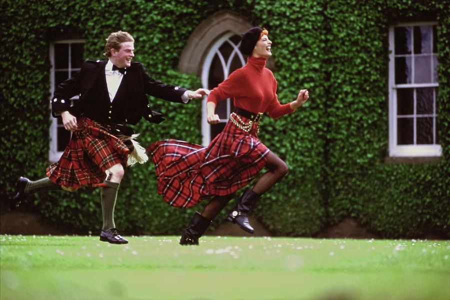 Linda Evangelista Running In A Red Tartan Skirt by Arthur Elgort