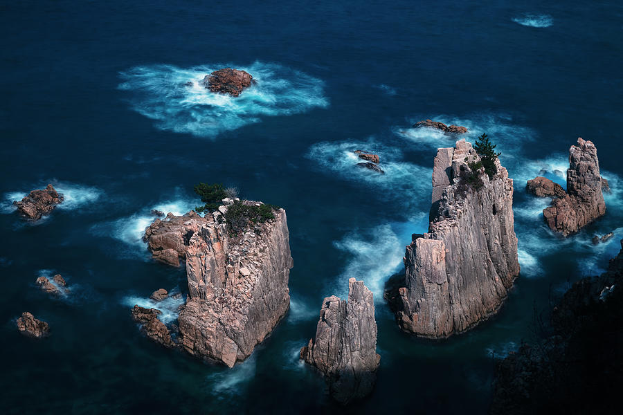 Oddly Shaped Rocks Towering Over The Sea Of Japan by Sunao Isotani