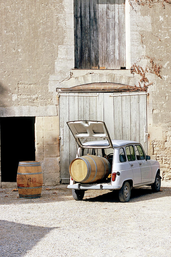 Old Renault In Front Of Vineyard Laden With Wine Barrel In Trunk Photograph by Jalag / Joerg Lehmann