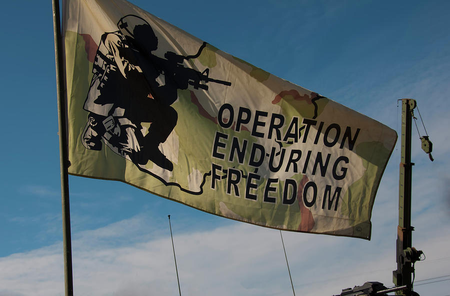 Operation Enduring Freedom flag blowing in the breeze Photograph by Flees Photos