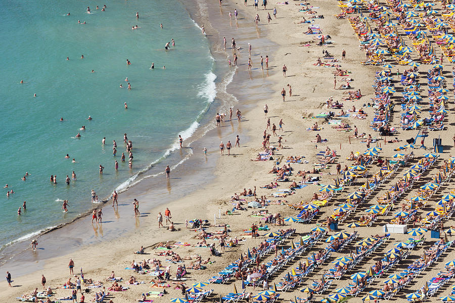 People Relaxing On Puerto Rico Beach by Jorg Greuel
