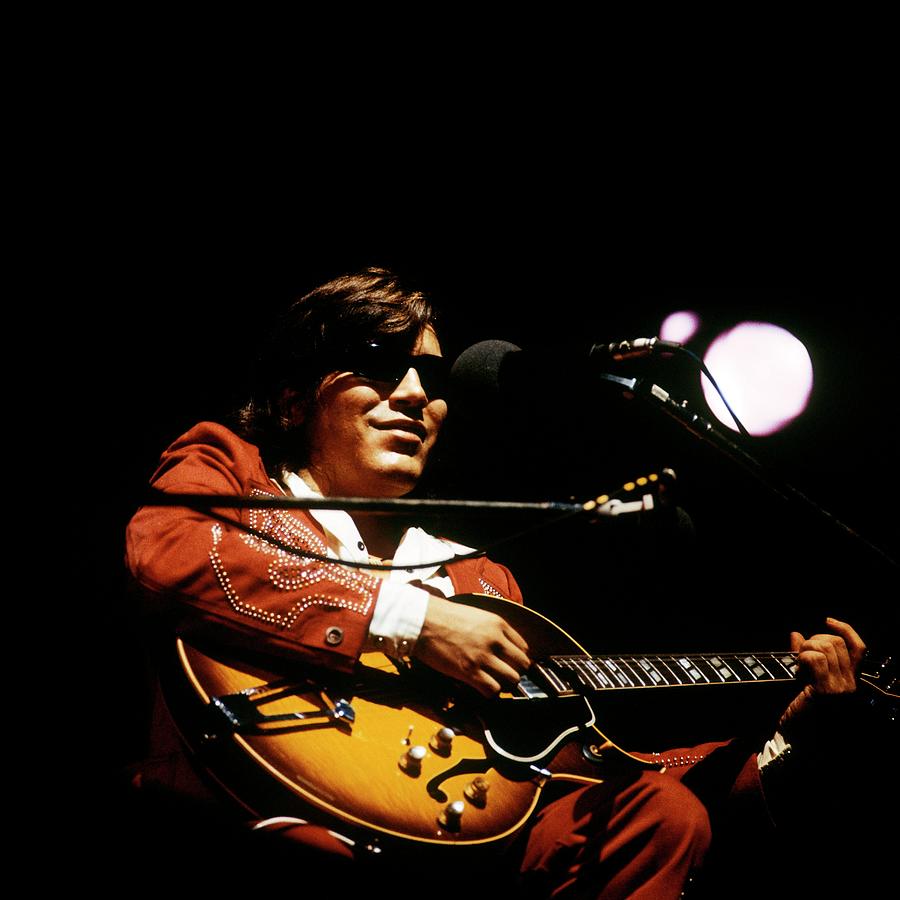 Performer in Red Suit with Guitar Photograph - Photo Of Jose Feliciano by David Redfern